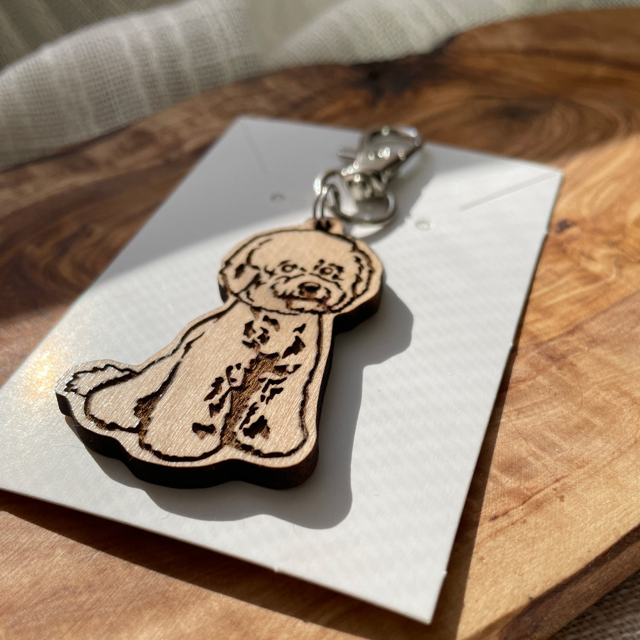 dog wooden keychain laying flat