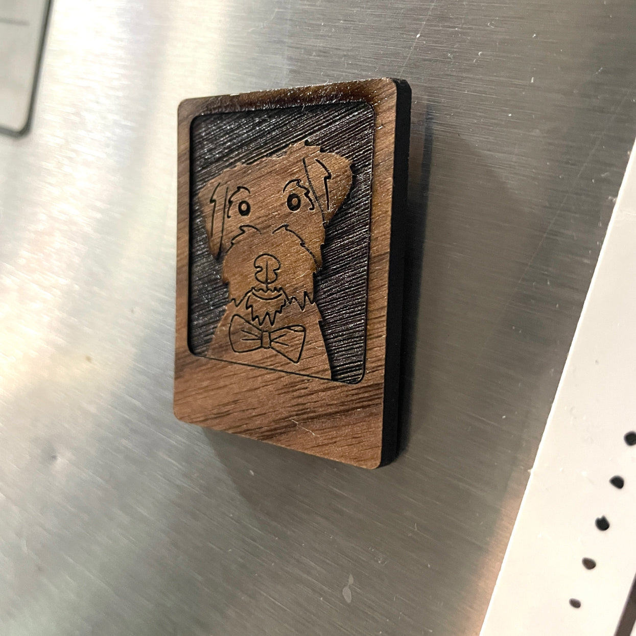 wooden magnet on fridge